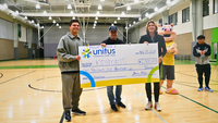 Unitus President CEO Steven Stapp, Quarterback Dillon Gabriel, Kidsports' Executive Director Bev Smith