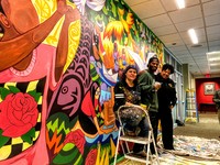 From left to right: Artists Addie Boswell and Antwoine Thomas with Fire Chief Sara Boone in front of the new mural