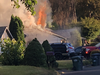 Flames showing from roof