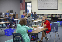 Students are spaced out in classrooms, and tables have plexiglass shields for extra precaution..