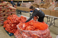 Kaiser Permanente volunteers safely prepare the 3,000 Sunshine Division food boxes that will be distributed on MLK Day 2021.