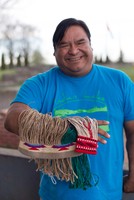 Corn husk weaver Michael Johnson (Umatilla County), practices a traditional style of corn husk twining called false embroidery -- an increasingly rare technique.