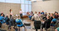 Community members participate in a small group conversation with City Councilors at Firstenburg Community Center