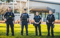 Four Vancouver Police Officers in front of the East Vancouver Precinct