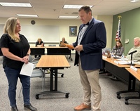 Board member Jane Long sworn in by Interim Superintendent Aaron Hansen