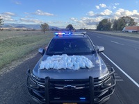 Seized drugs on patrol car hood