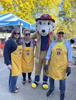 Sue Hartin pictured with Sparky, Jody Cross, and Lisa Edwards at the Camas Washougal Fire Department Open House