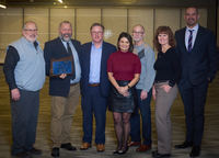 Mark Utti (second from left) pictured with Lewis & Clark Bank team members (left to right) Jack Ficken, Jeff Sumpter, Cheryl Boedigheimer, John Lende, Jami Reynolds, and Colby Schlicker.